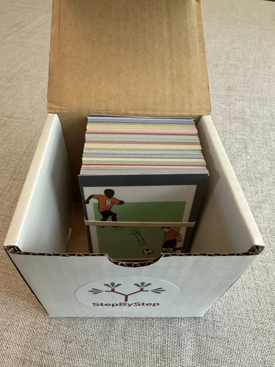 Open StepByStep card box filled with laminated sequence cards